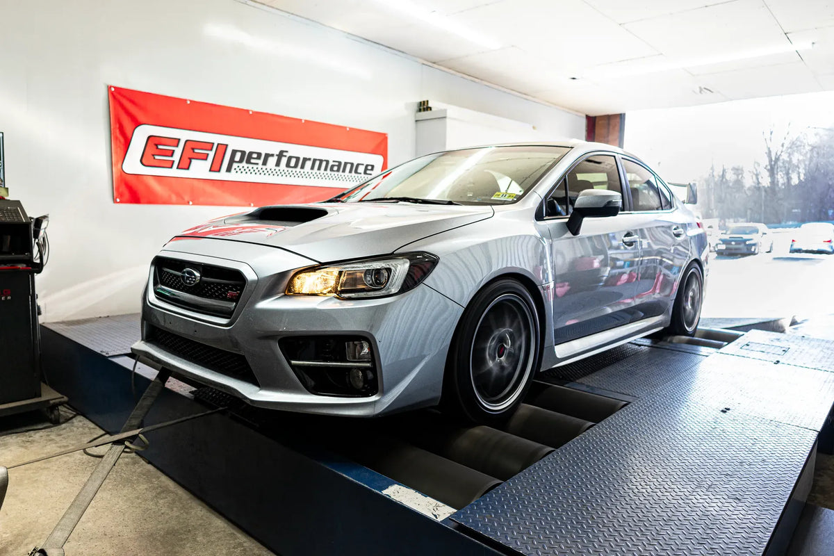 A silver Subaru WRX STI on the dyno beneath the EFI Performance banner.