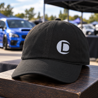 Black Dotson Tuning baseball cap with embroidered silver D logo and curved brim.